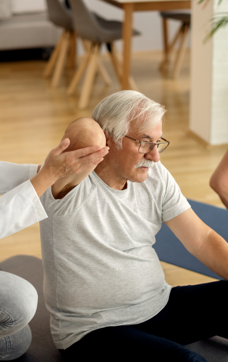 physical-therapist-assisting-mature-couple-with-exercises-home